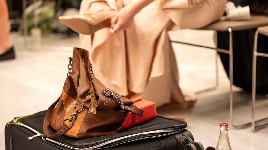 Woman is putting on her shoes before traveling.