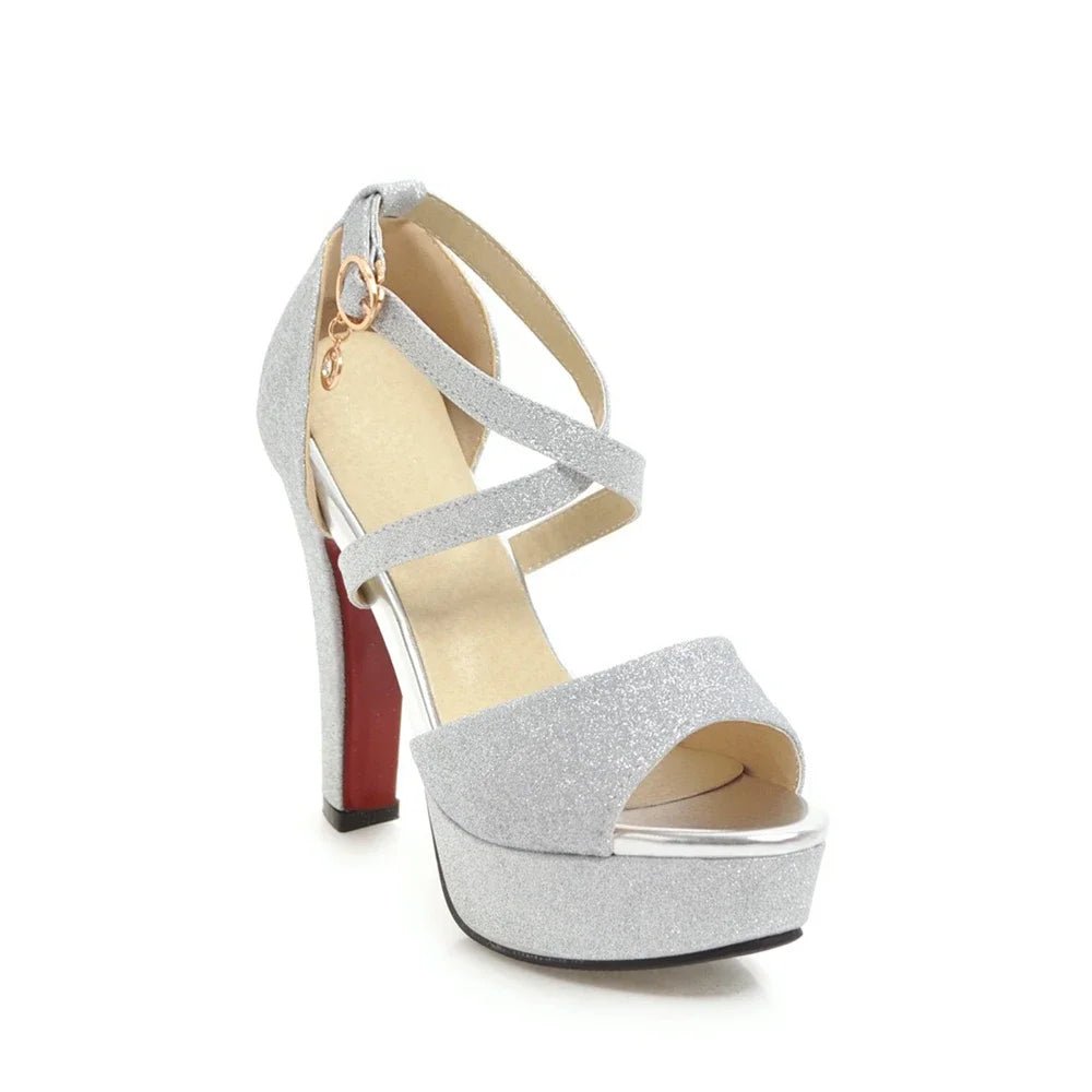 Silver glitter high-heeled shoe on a white background