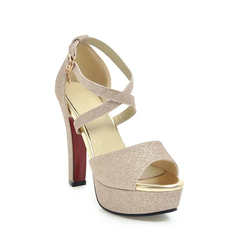 Gold glitter high-heeled sandal on a white background