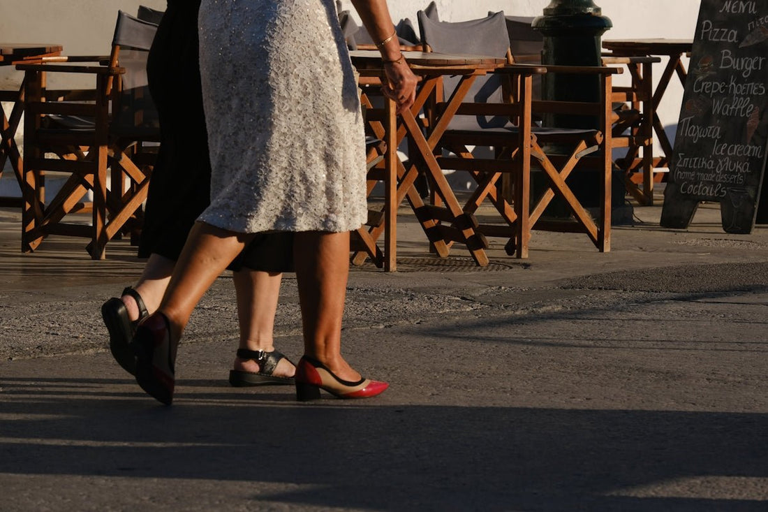 a couple of people that are walking down a street