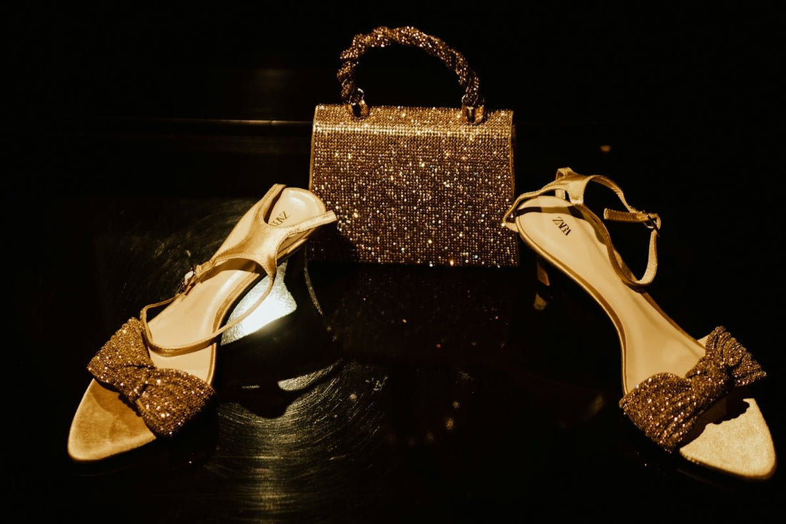 A sparkly gold handbag and matching high-heeled sandals