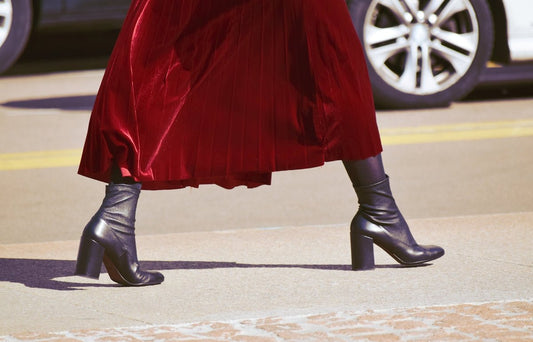 woman in red dress and black leather boots