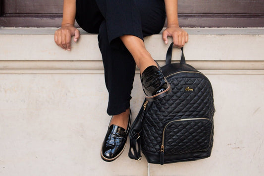 woman in black dress and black leather flats