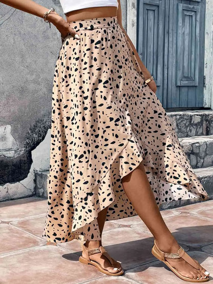 Person wearing a leopard print skirt with a neutral background