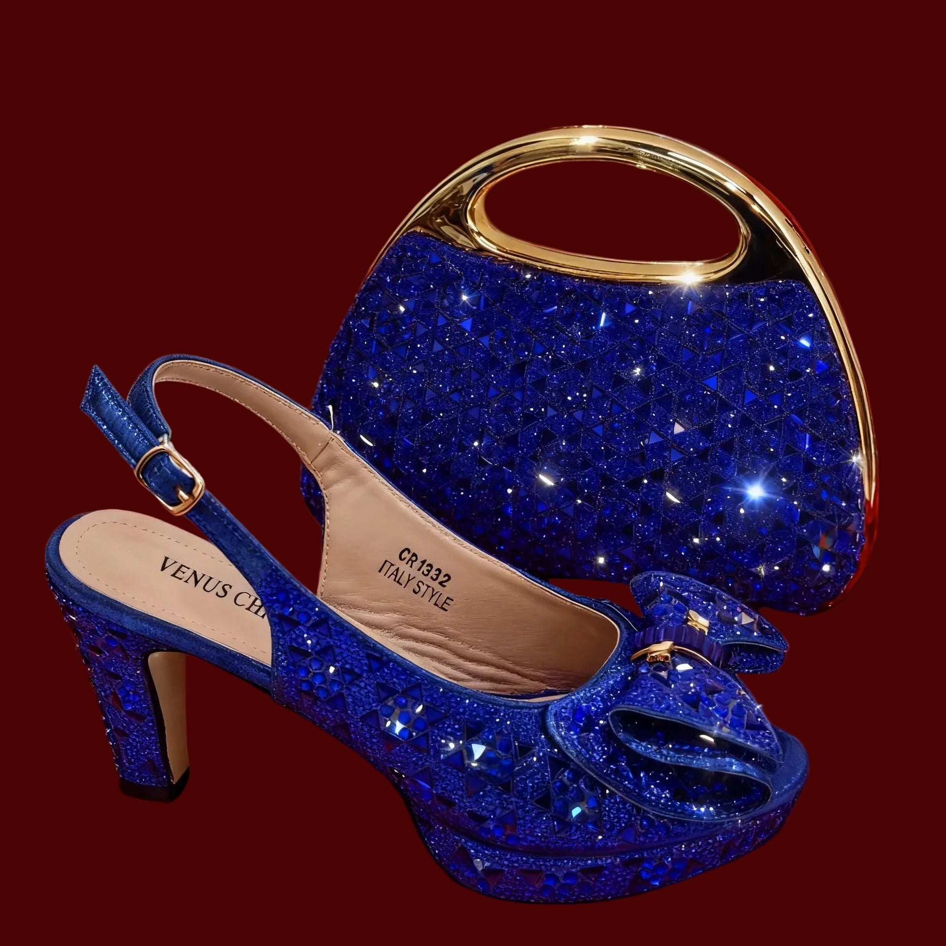 A pair of royal blue glittery high-heeled slingback shoes with a matching glittery handbag featuring a gold-tone handle, displayed on a maroon background.