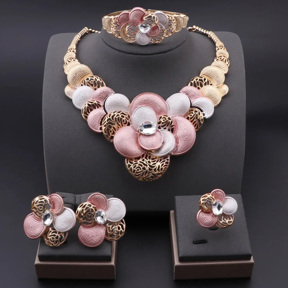Multi-color (pink and gold) Jewelry set with necklace, bracelet, ring, and earrings on a dark background