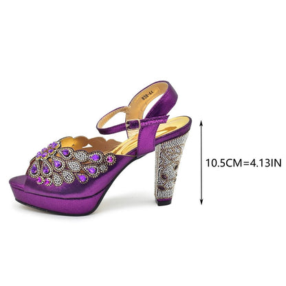 Purple high-heeled shoe with embellishments on a white background