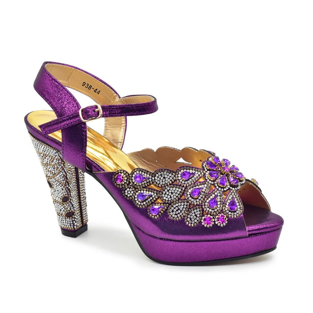 Purple high-heeled shoe with decorative embellishments on a white background