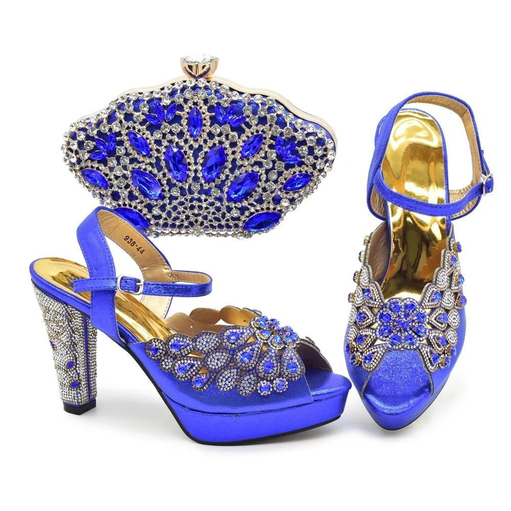 Blue high-heeled shoes with intricate designs and matching clutch on a white background