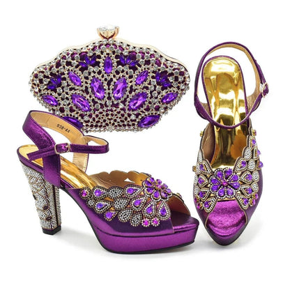Purple high-heeled shoes with gold accents and a matching purple clutch on a white background