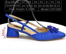 Blue Italian rhinestone heels with a bow on a white background, featuring heel height and size chart.