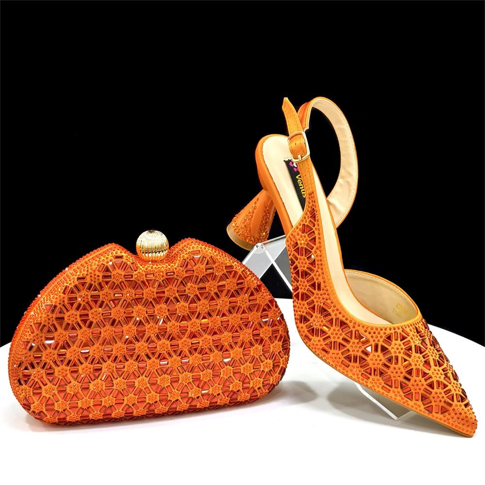 Orange woven clutch bag and high-heeled Italian shoes on a white surface with a black background