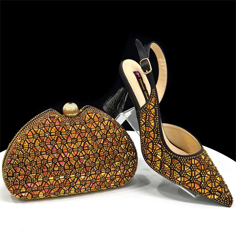 Black and Gold colored decorative clutch bag and high-heeled Italian shoes with geometric pattern on a white surface.