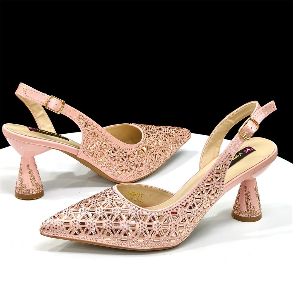 Pair of champagne high-heeled Italian shoes with intricate designs on a white background