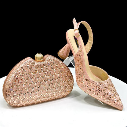 Champagne high-heeled Italian shoes and matching handbag on a white surface with a black background
