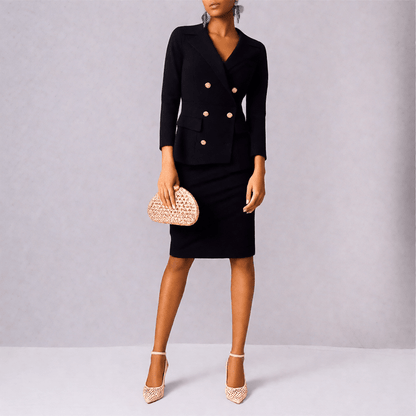 Woman wearing champagne high-heeled Italian shoes and holding a matching handbag against a gray background