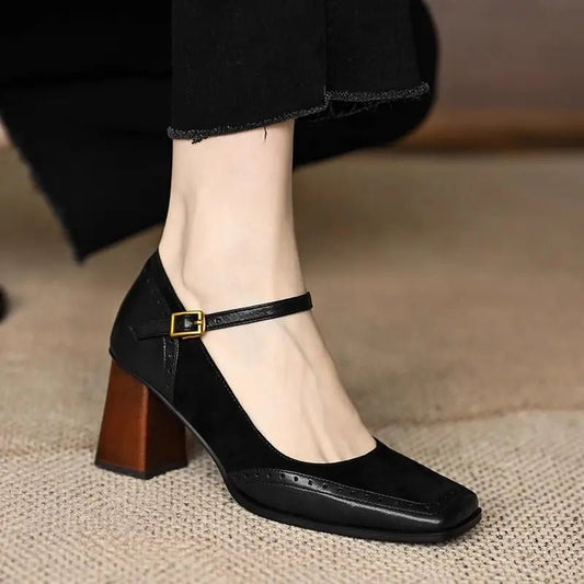 Black high-heeled Mary Jane Block Heel Pumps on a neutral background