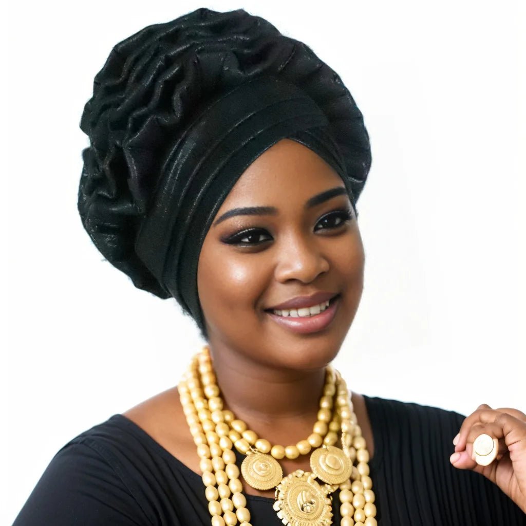 Woman wearing a black Nigerian auto gele headwrap on a white background