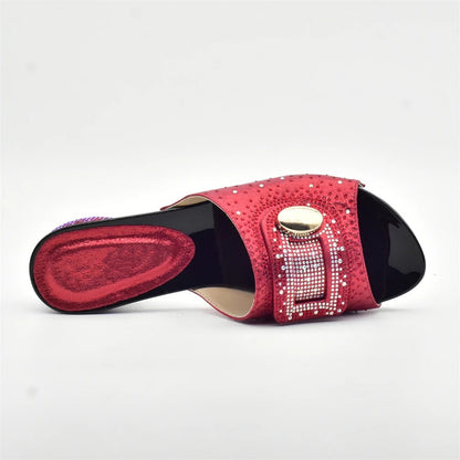 Red Trendy Italian Design Slip-on Shoe with rhinestone details on a white background