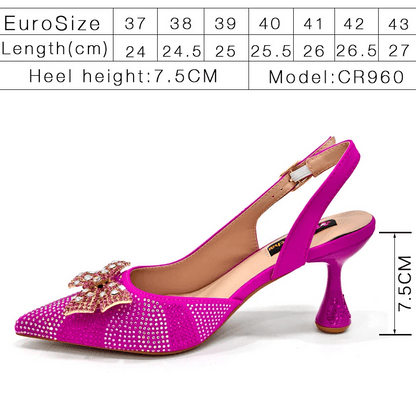 Fuchsia high-heeled shoe with rhinestone embellishment and size chart on a white background