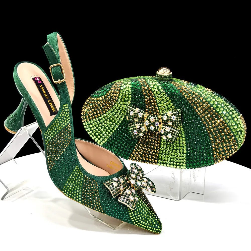 Green studded high-heeled shoes with matching clutch on a white background